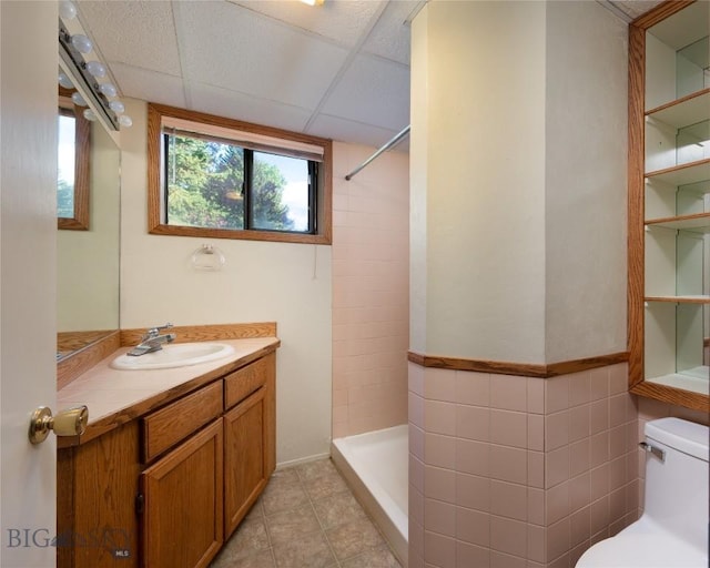 1524 S Grand, Bozeman, MT 59715 - full bath with toilet, tiled shower, vanity, and tile patterned flooring