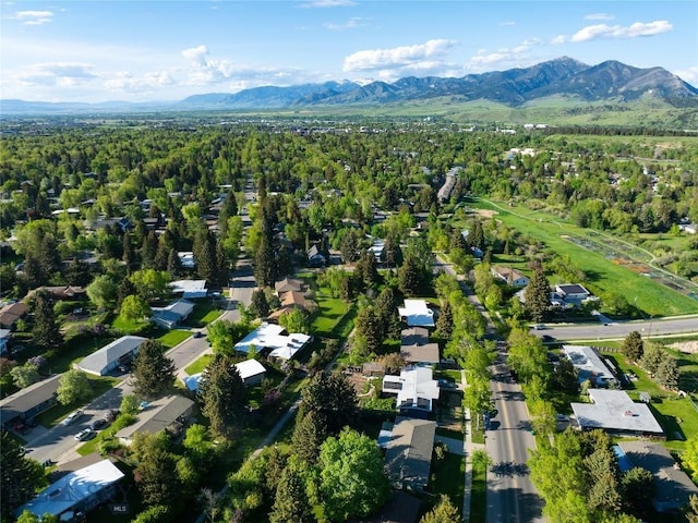 1524 S Grand, Bozeman, MT 59715 - aerial view of property's location featuring a mountainous background, nearby suburban area, and a forest