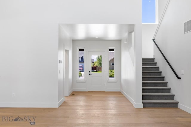 4149 Annie St, Bozeman, MT 59718 - entryway featuring stairs, light wood-type flooring, and baseboards