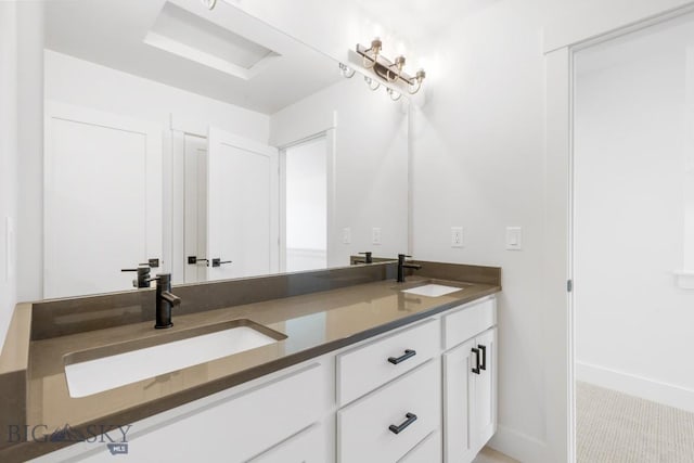 4149 Annie St, Bozeman, MT 59718 - bathroom featuring double vanity and baseboards