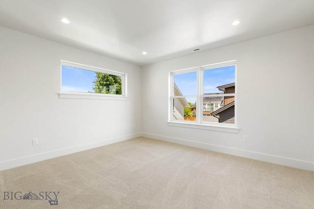 4149 Annie St, Bozeman, MT 59718 - unfurnished room featuring plenty of natural light, baseboards, light carpet, and recessed lighting