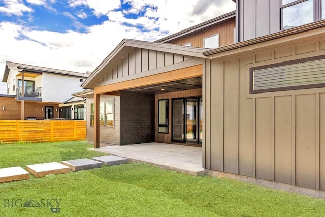 4149 Annie St, Bozeman, MT 59718 - rear view of house featuring board and batten siding and a patio area