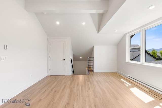 4149 Annie St, Bozeman, MT 59718 - additional living space with a baseboard heating unit, lofted ceiling, light wood-type flooring, baseboards, and recessed lighting