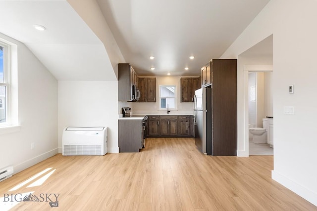 4149 Annie St, Bozeman, MT 59718 - kitchen with stainless steel appliances, a sink, light countertops, baseboards, and light wood-type flooring