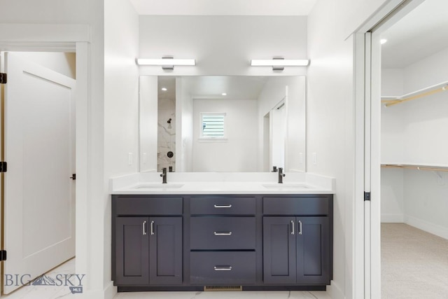 4149 Annie St, Bozeman, MT 59718 - bathroom with double vanity, baseboards, a shower, and a spacious closet