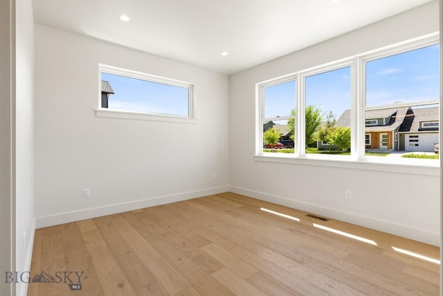 4149 Annie St, Bozeman, MT 59718 - unfurnished room with baseboards, light wood-style floors, and recessed lighting