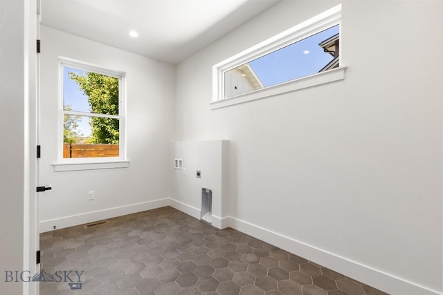 4149 Annie St, Bozeman, MT 59718 - washroom with hookup for an electric dryer, hookup for a washing machine, dark tile patterned floors, baseboards, and recessed lighting
