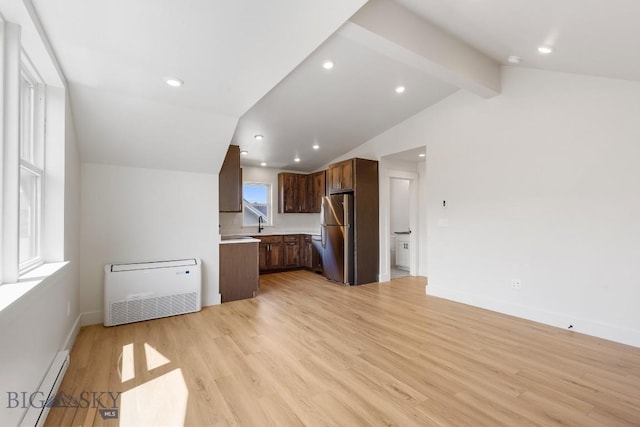 4149 Annie St, Bozeman, MT 59718 - unfurnished living room featuring a baseboard radiator, light wood-type flooring, baseboards, and recessed lighting