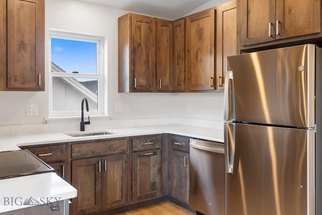 4149 Annie St, Bozeman, MT 59718 - kitchen with appliances with stainless steel finishes, a sink, and light countertops