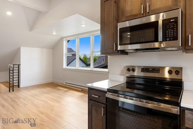 4149 Annie St, Bozeman, MT 59718 - kitchen featuring appliances with stainless steel finishes, a baseboard heating unit, light countertops, light wood-style floors, and recessed lighting