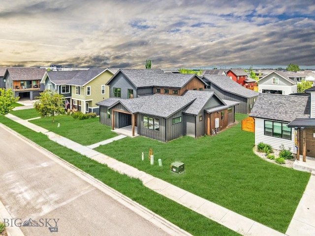 4149 Annie St, Bozeman, MT 59718 - view of front of home with a residential view, a front yard, and a garage