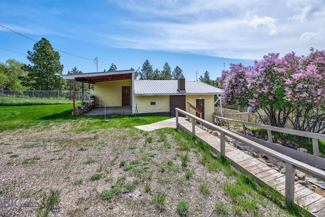3456 Wave, Helena, MT 59602 - view of front facade featuring metal roof and a chimney