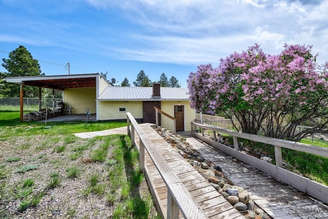 3456 Wave, Helena, MT 59602 - view of front of home featuring a chimney and metal roof