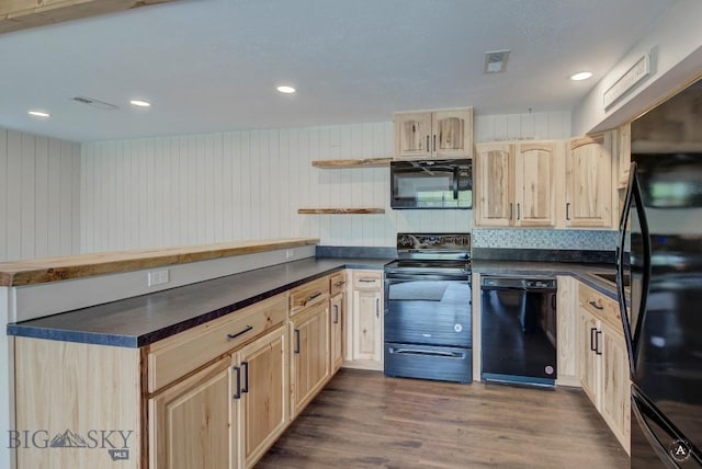 3456 Wave, Helena, MT 59602 - kitchen with black appliances, light brown cabinetry, dark countertops, a peninsula, and recessed lighting