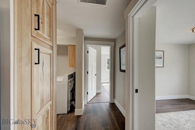 3456 Wave, Helena, MT 59602 - hall with washer / clothes dryer, dark wood finished floors, and baseboards