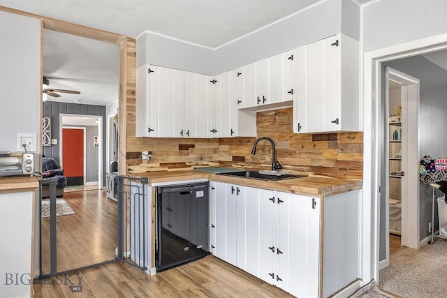 3101 Paxson, Butte, MT 59701 - kitchen with black dishwasher, wooden counters, a sink, tasteful backsplash, and a ceiling fan
