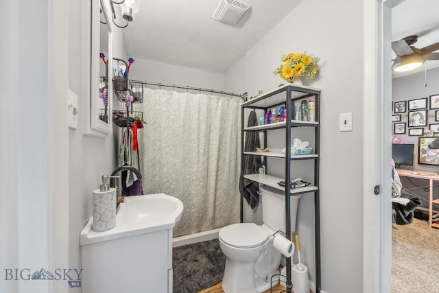 3101 Paxson, Butte, MT 59701 - bathroom with vanity, toilet, and a shower with shower curtain