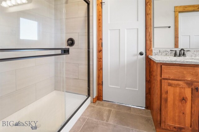 9 Murray Ln, Three Forks, MT 59721 - bathroom with a shower stall, vanity, and tile patterned flooring
