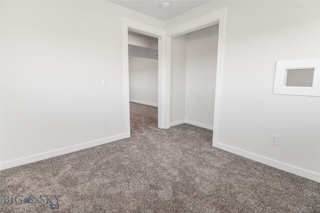 9 Murray Ln, Three Forks, MT 59721 - unfurnished bedroom featuring carpet flooring and baseboards
