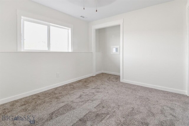 9 Murray Ln, Three Forks, MT 59721 - unfurnished room with carpet floors and baseboards