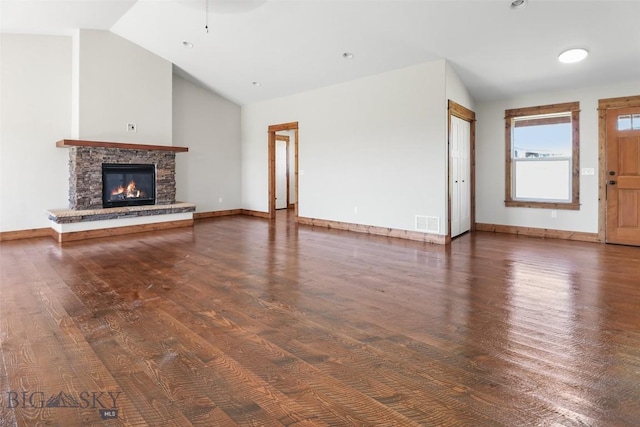 9 Murray Ln, Three Forks, MT 59721 - unfurnished living room featuring wood finished floors, lofted ceiling, and a fireplace