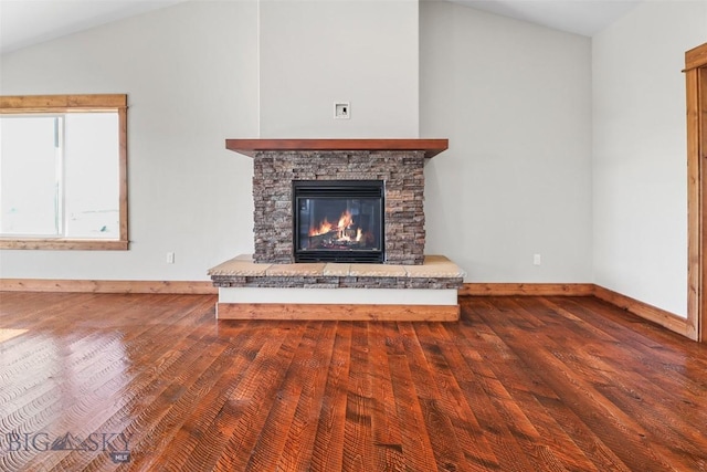 9 Murray Ln, Three Forks, MT 59721 - unfurnished living room featuring wood finished floors, a stone fireplace, and vaulted ceiling