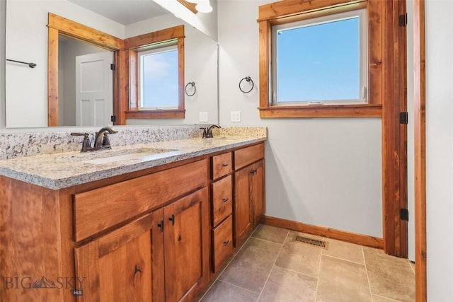 9 Murray Ln, Three Forks, MT 59721 - full bathroom featuring double vanity and baseboards