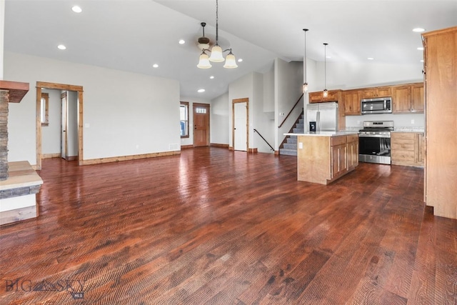9 Murray Ln, Three Forks, MT 59721 - kitchen featuring appliances with stainless steel finishes, open floor plan, light countertops, a kitchen island, and decorative light fixtures