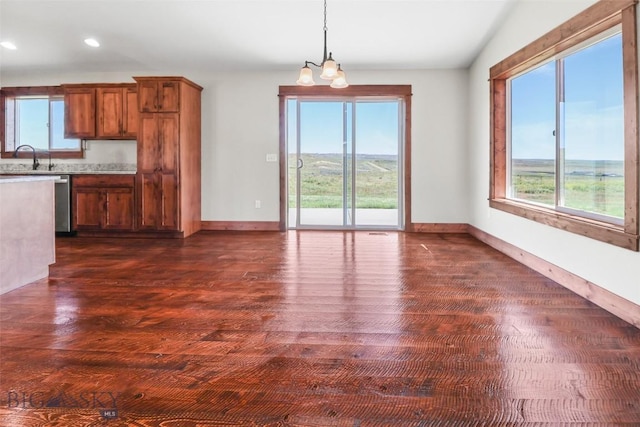 9 Murray Ln, Three Forks, MT 59721 - kitchen with plenty of natural light, light countertops, brown cabinetry, decorative light fixtures, and recessed lighting