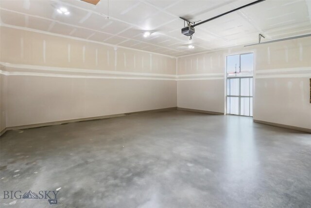 9 Murray Ln, Three Forks, MT 59721 - garage with baseboards and a garage door opener