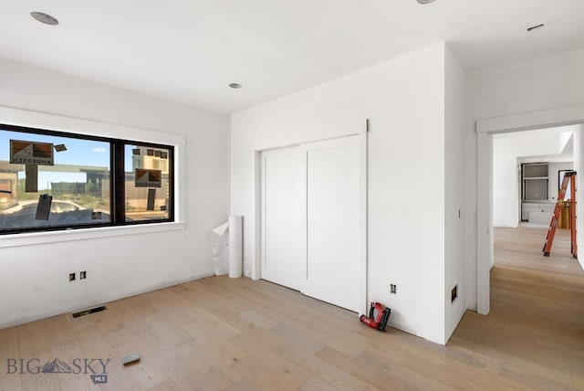 286 Lion Peak, Bozeman, MT 59718 - unfurnished bedroom featuring light wood-type flooring