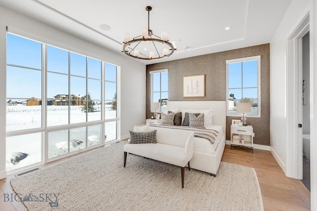 529 Clancy Way, Bozeman, MT 59718 - bedroom featuring a chandelier, light wood-type flooring, and wallpapered walls