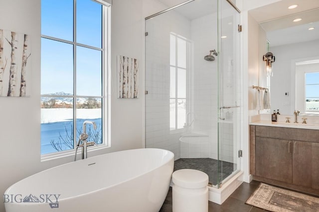 529 Clancy Way, Bozeman, MT 59718 - bathroom featuring a stall shower, a freestanding bath, vanity, recessed lighting, and tile patterned flooring