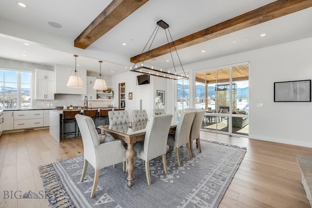 529 Clancy Way, Bozeman, MT 59718 - dining room featuring beamed ceiling, healthy amount of natural light, recessed lighting, and light wood-style flooring