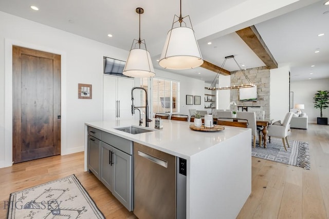 529 Clancy Way, Bozeman, MT 59718 - kitchen with dishwasher, gray cabinets, light wood finished floors, open floor plan, and light countertops