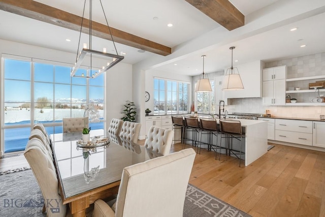529 Clancy Way, Bozeman, MT 59718 - dining room with light wood finished floors, beam ceiling, a chandelier, and recessed lighting