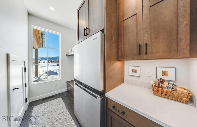 529 Clancy Way, Bozeman, MT 59718 - kitchen featuring freestanding refrigerator, light countertops, dark tile patterned flooring, and recessed lighting
