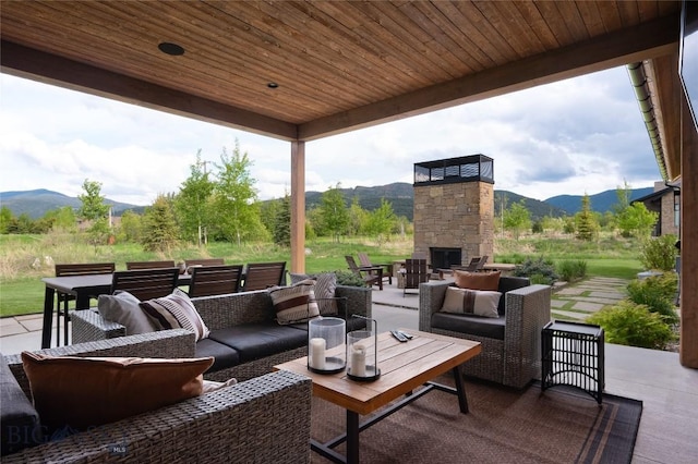529 Clancy Way, Bozeman, MT 59718 - view of patio featuring an outdoor living space with a fireplace and a mountain view