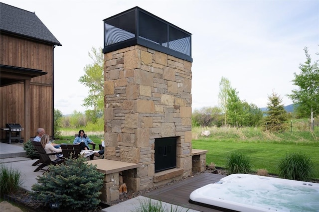 529 Clancy Way, Bozeman, MT 59718 - view of patio / terrace featuring an outdoor stone fireplace and grilling area