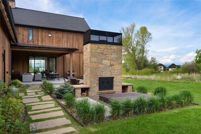 529 Clancy Way, Bozeman, MT 59718 - view of patio / terrace with an outdoor living space with a fireplace