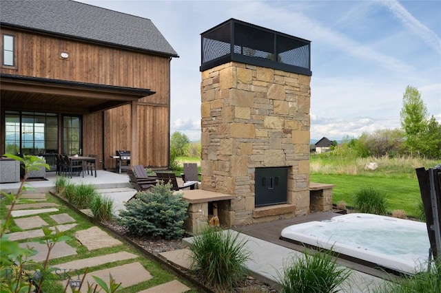 529 Clancy Way, Bozeman, MT 59718 - view of patio with an outdoor stone fireplace and grilling area
