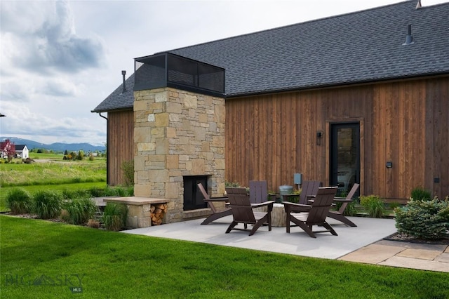 529 Clancy Way, Bozeman, MT 59718 - view of patio featuring a fireplace and a mountain view