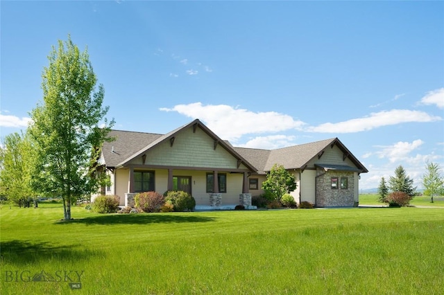 45 Spain Bridge Circle Dr, Belgrade, MT 59714 - craftsman house featuring a front lawn, covered porch, and a shingled roof