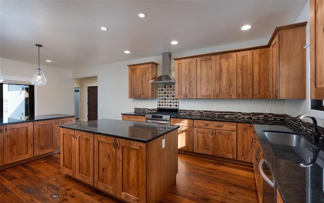 45 Spain Bridge Circle Dr, Belgrade, MT 59714 - kitchen with wall chimney exhaust hood, a sink, a kitchen island, brown cabinets, and recessed lighting