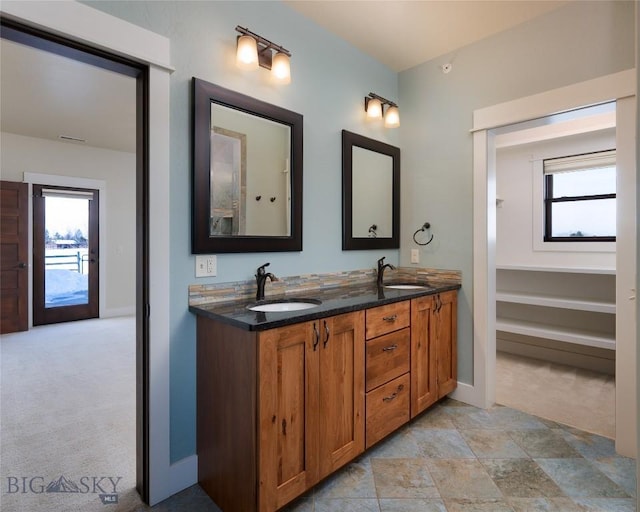 45 Spain Bridge Circle Dr, Belgrade, MT 59714 - bathroom with double vanity and baseboards