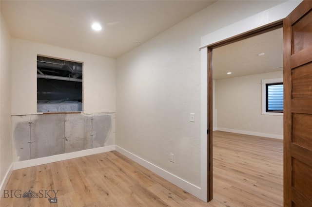 45 Spain Bridge Circle Dr, Belgrade, MT 59714 - unfurnished room featuring wood finished floors, baseboards, and recessed lighting