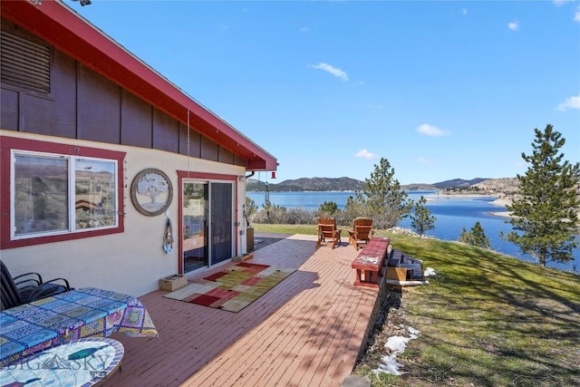 8422 Lake Park Trl, Helena, MT 59602 - view of patio with a deck with water view