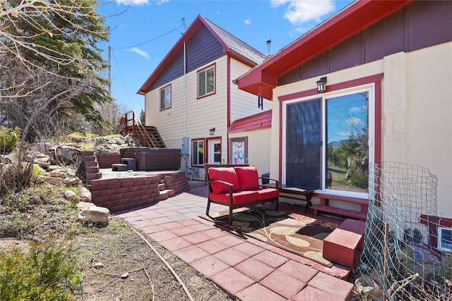 8422 Lake Park Trl, Helena, MT 59602 - view of patio / terrace featuring a hot tub, stairway, and an outdoor living space