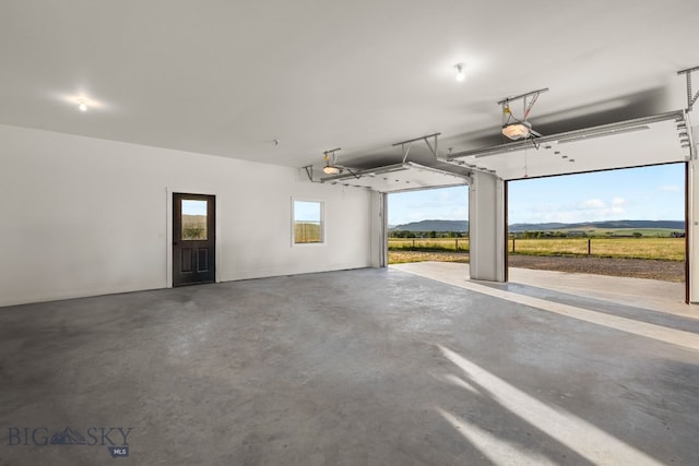 64 Duke Dr, Harrison, MT 59735 - garage featuring a garage door opener