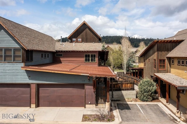 151B Pheasant Tail Unit B, Big Sky, MT 59716 - view of front facade featuring an attached garage and driveway